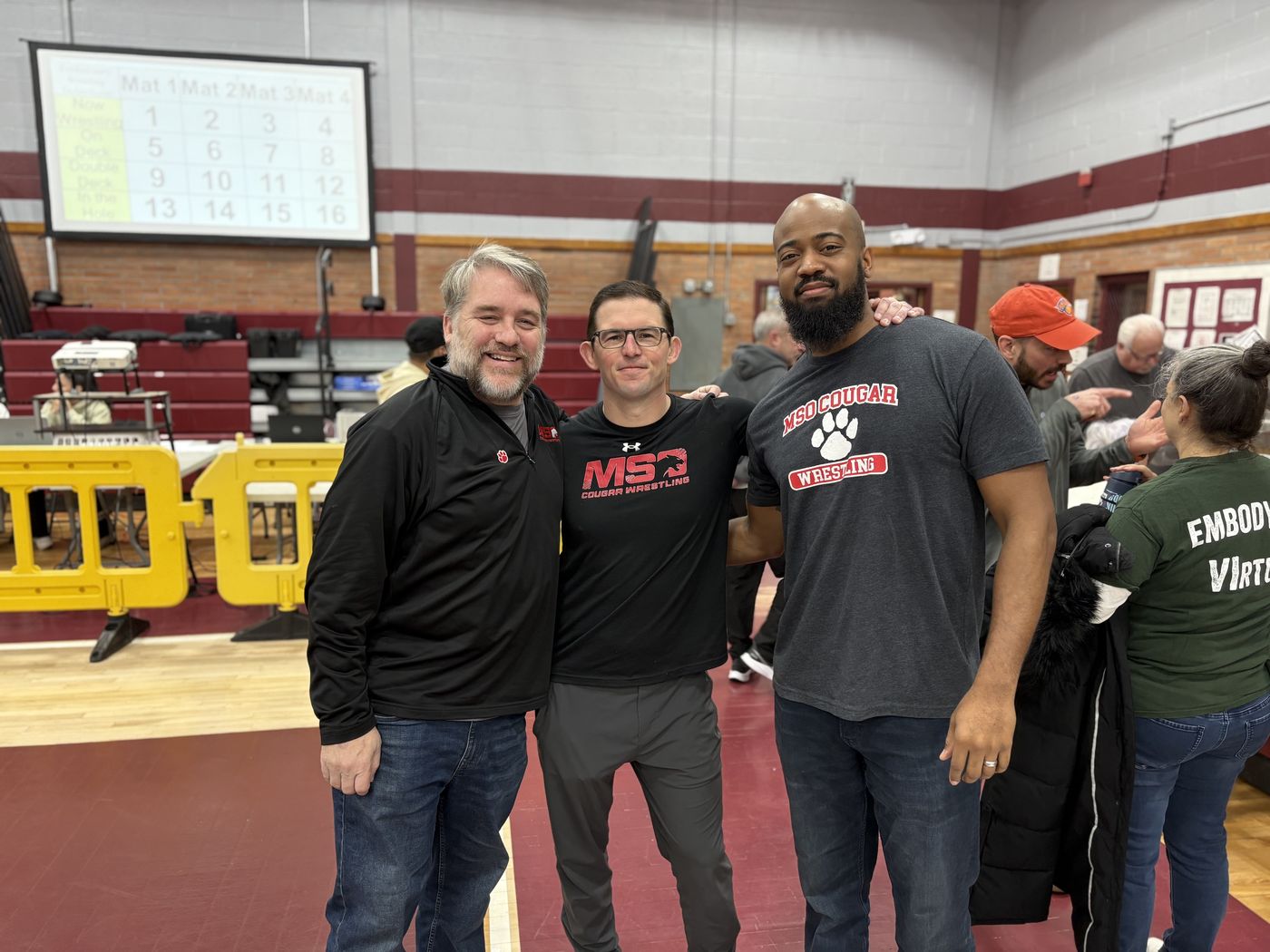 Three MSO coaches together at a tournament.